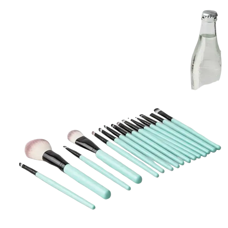 Set of 15 mint green and black synthetic makeup brushes with soft bristles neatly arranged on a marble surface