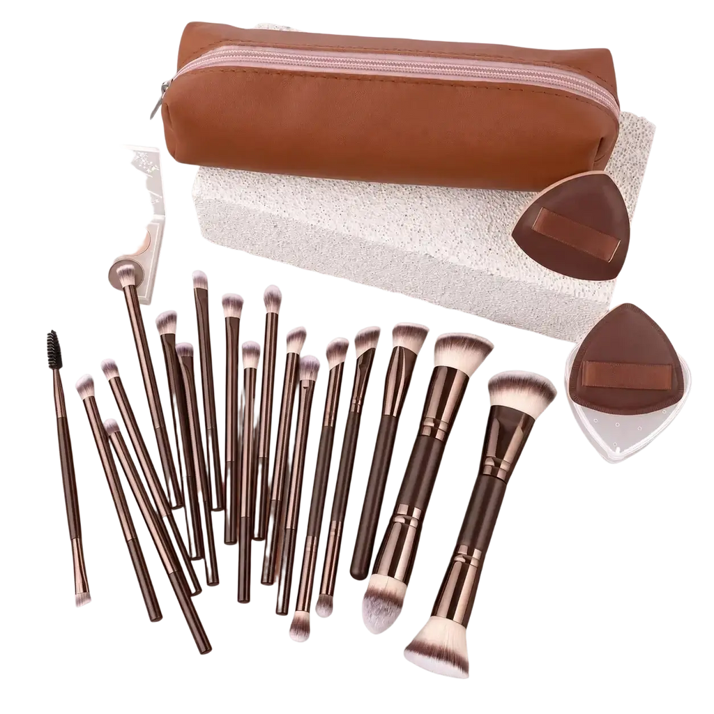 Brown leather makeup brush set with metallic accents and wool fiber white bristles in a travel case
