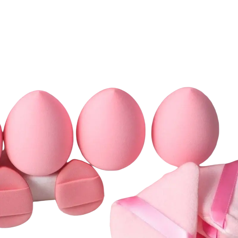 Soft pink oval-shaped makeup sponges with smooth matte finish for precise eye makeup application in brush set