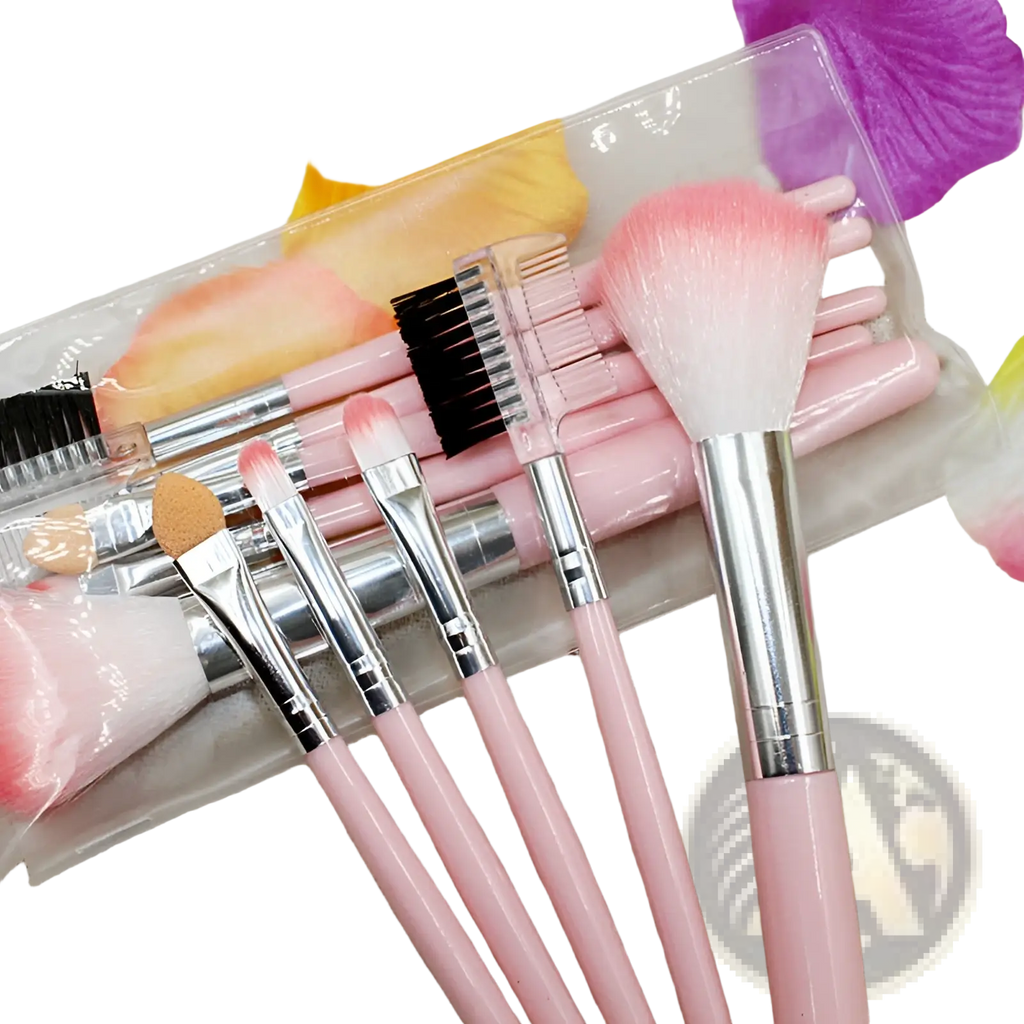 Makeup brush set with five pink gradient bristle tools featuring silver ferrules and soft bristles in a clear case