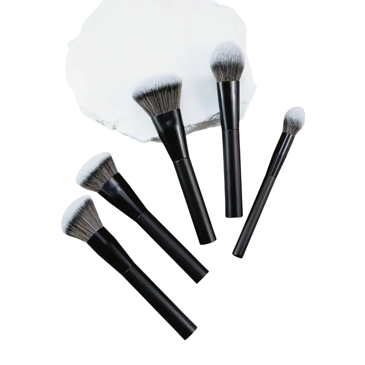 Set of five professional makeup brushes with black handles and soft gradient gray to white bristles on neutral surface