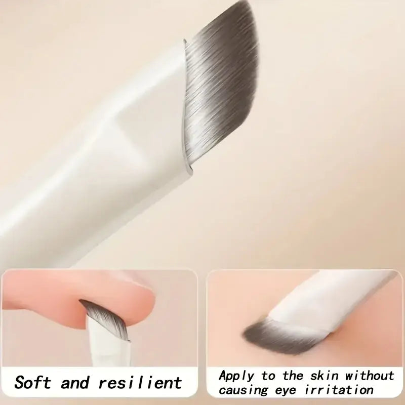 White-handled makeup brush with soft angled bristles for precise eyebrow application from 5 piece eye travel kit