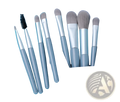 Makeup brush set with seven gray and silver brushes in a blue leather case for professional use