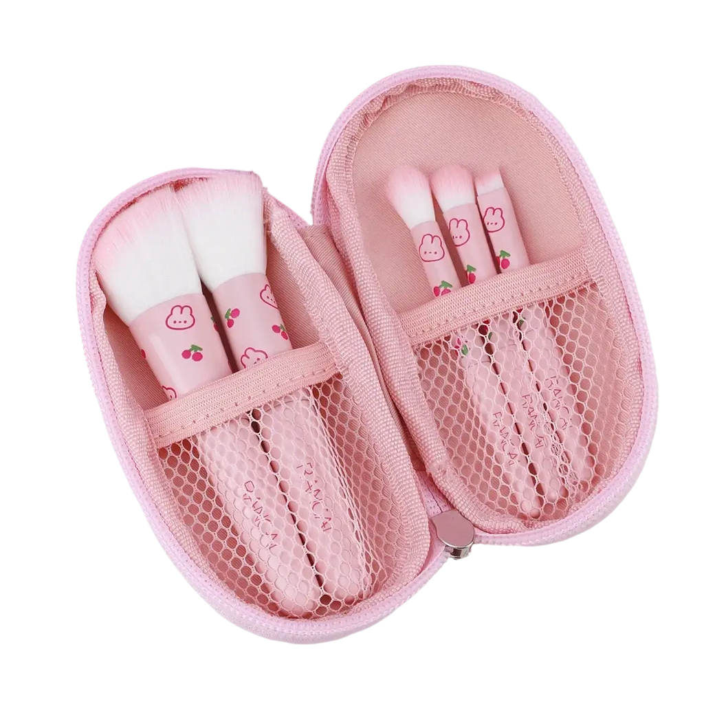 Pink mesh makeup brush case with cute bunny and cherry designs holding matching pink makeup brushes set