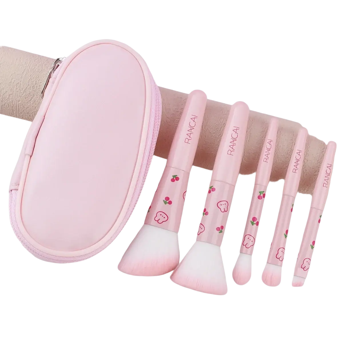 Pink rancai makeup brush set with soft white bristles and cherry ghost designs on handles in a cute pink 5 piece case
