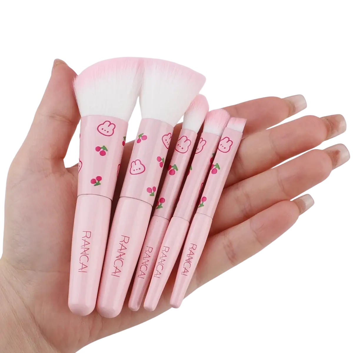 Pink rancai makeup brush set with five pieces featuring cherry and bunny designs on handles in a cute pink case