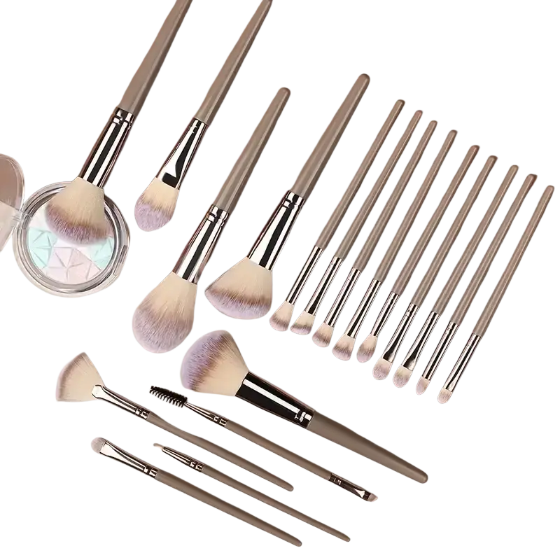 A set of 12 sleek metallic-finished professional makeup brushes with synthetic gradient beige and lavender bristles