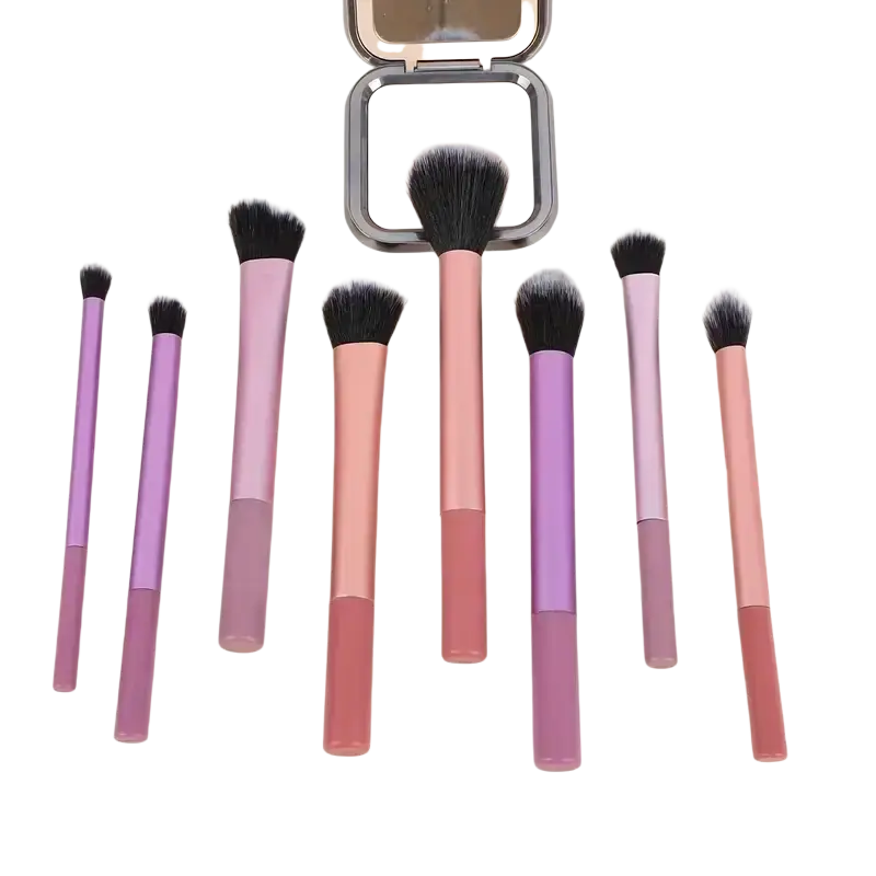 Set of seven synthetic hair makeup brushes with pastel pink and purple gradient handles around compact powder