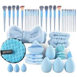 A 46 piece makeup brush and sponge set with light blue brushes, silver handles, and fluffy accessories for eye makeup application