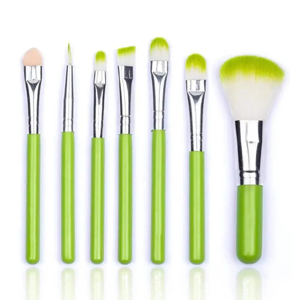 Set of seven professional synthetic foundation and face brushes with green handles silver ferrules and gradient bristles