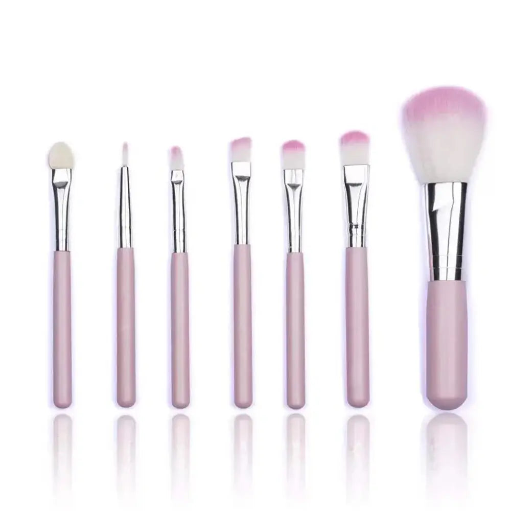 Set of seven professional synthetic foundation and face brushes with matte pink handles and soft synthetic bristles