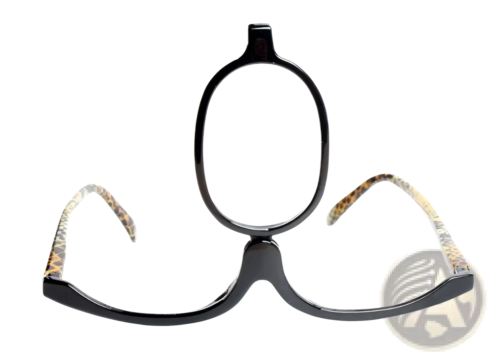 Black-framed makeup reading glasses with leopard-print temples and plus 1.00 lens for discreet one-eye use