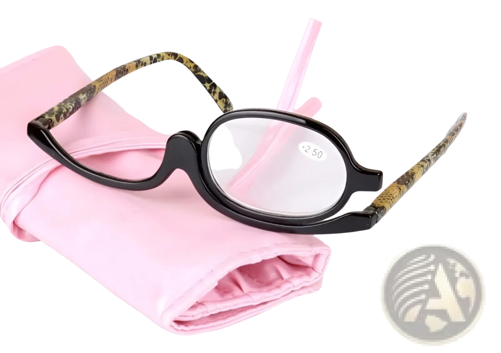 Black-framed makeup reading glasses with gold-toned patterned temple arms and +2.50 strength lenses resting on pink case