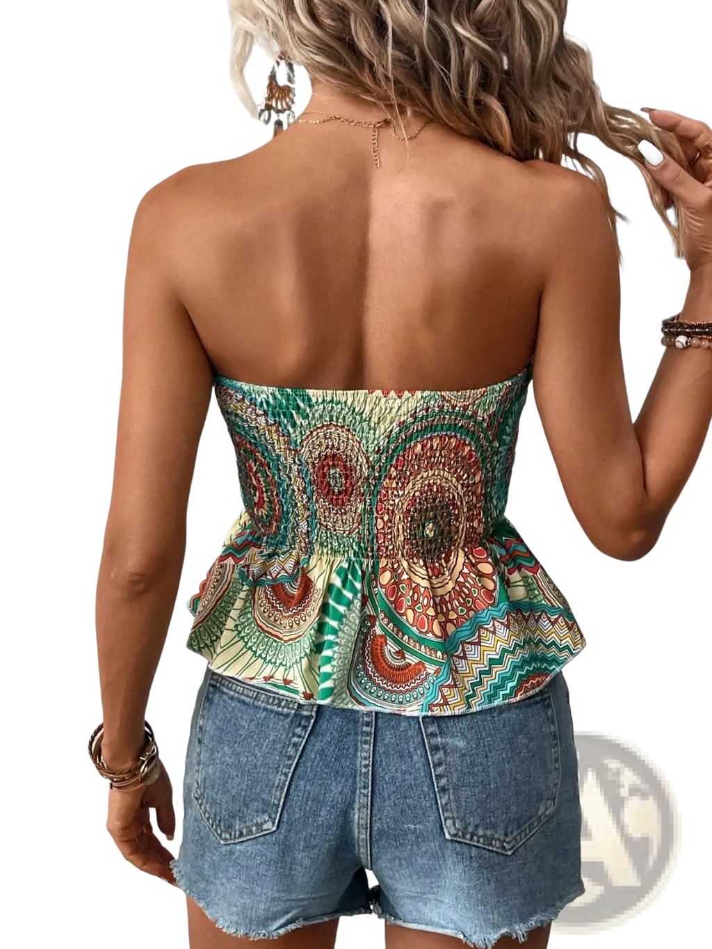 A vibrant strapless mandala print peplum tube top in green red and beige with intricate patterned fabric