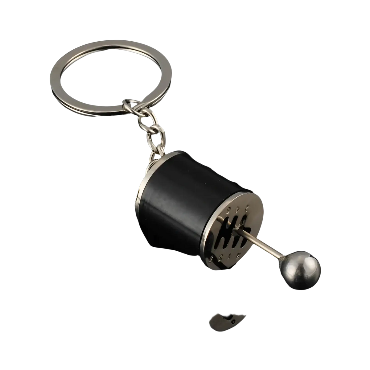 Black and silver metal manual gear shift car keychain with a metallic ball end for automotive enthusiasts