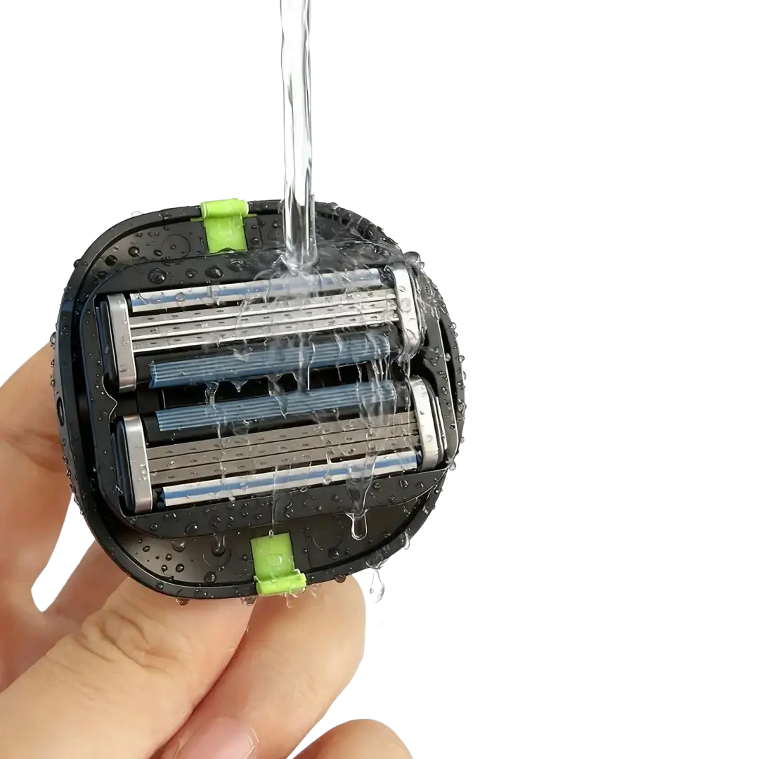 Black electric grooming tool with three silver blades and green accents held under running water for head and body shave