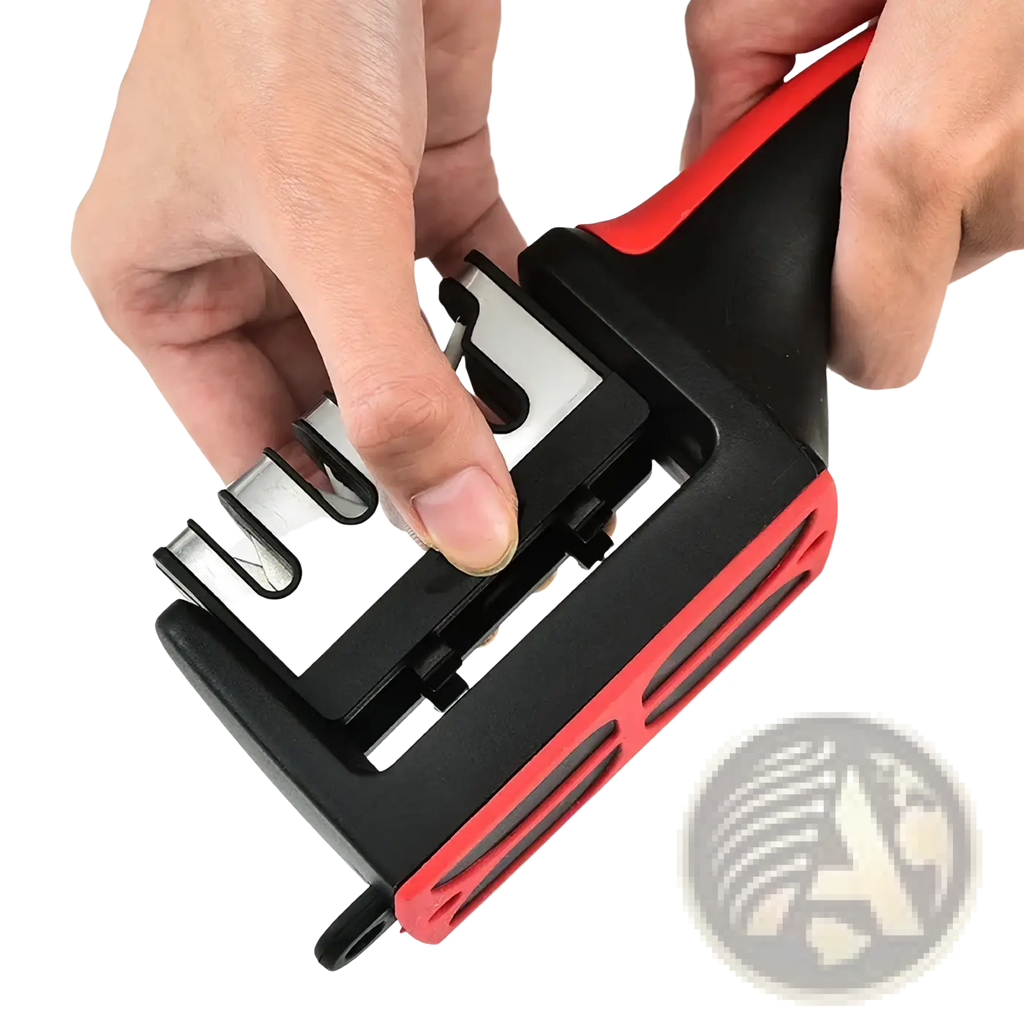 Manual knife sharpener handheld tool in black and red with textured grip and multiple slots for blade angles