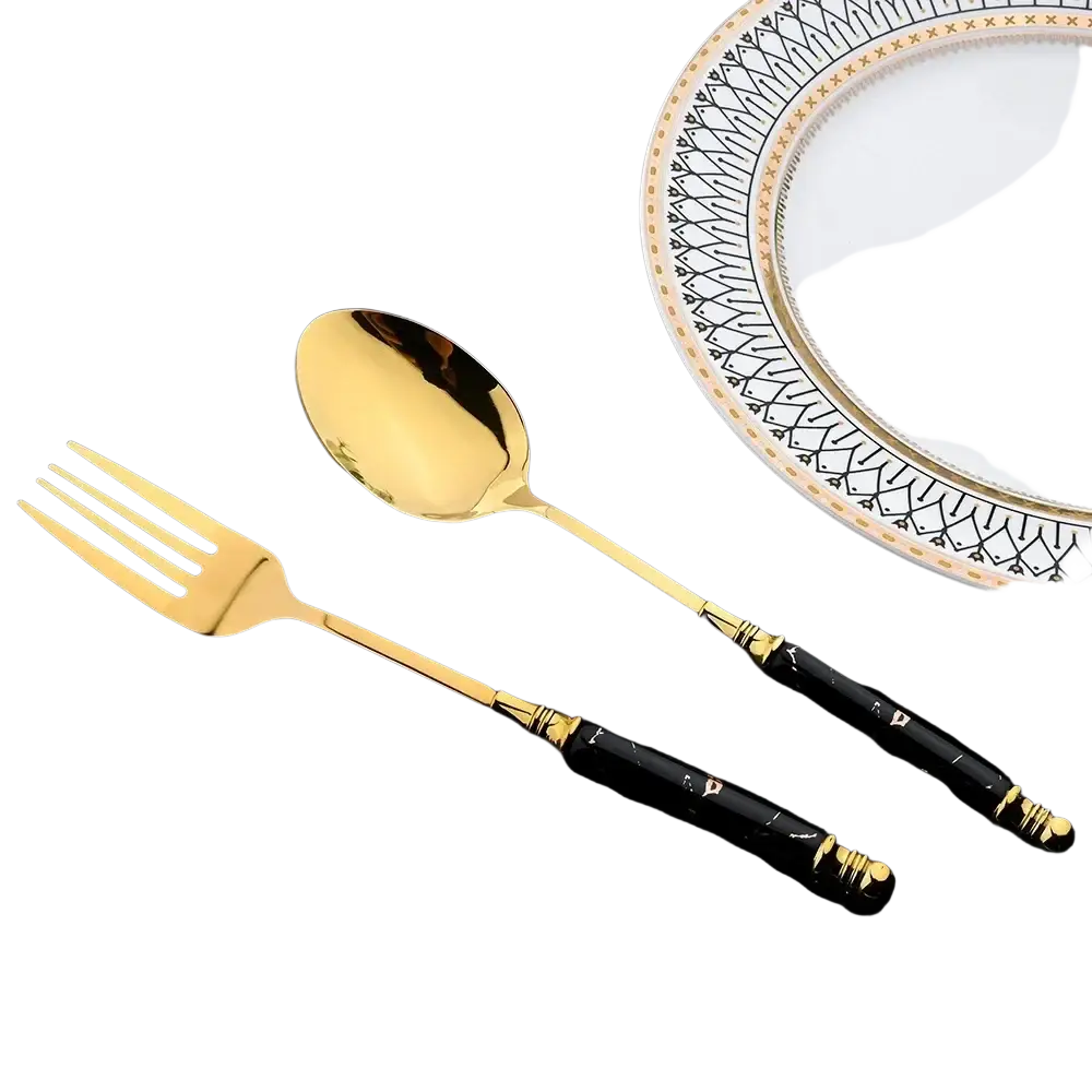Gold-finished fork and spoon with black marble-patterned handles from the marble handle gold cutlery set 24-piece