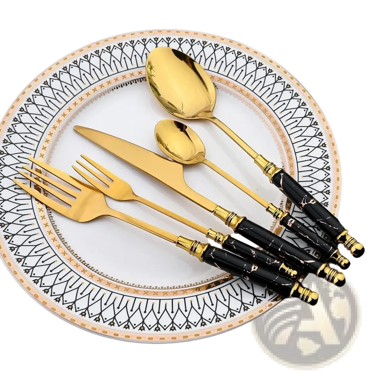 Golden stainless steel marble handle gold cutlery set with black marble-patterned handles and gold accents on white plate