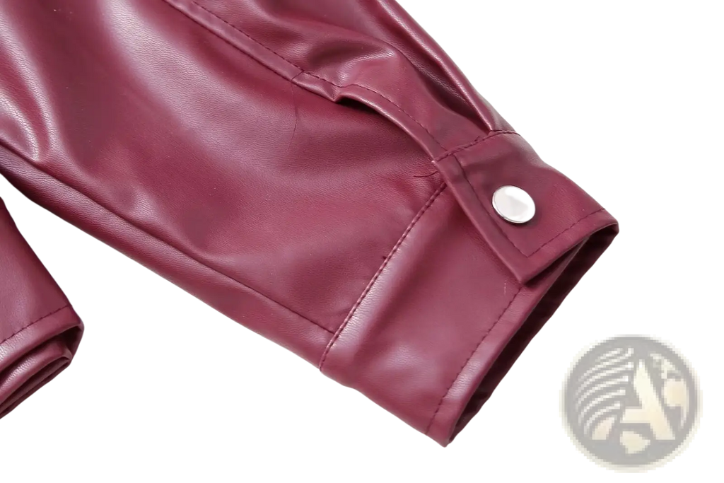 Maroon faux leather biker jacket sleeve for women featuring a silver button closure detail