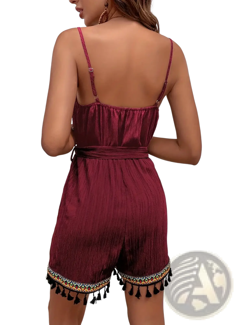 Maroon satin romper with thin straps cinched waist belt and decorative tassel trim for stylish summer wear