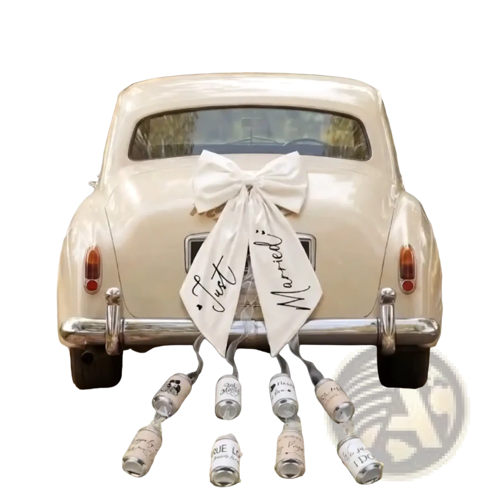 Cream-colored vintage car decorated with a large white satin bow and just married ribbon for wedding decor