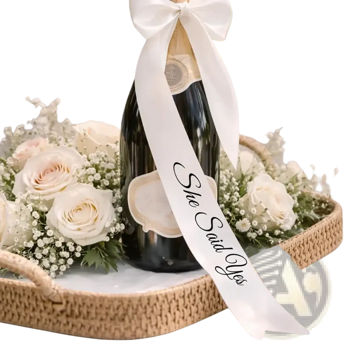 Just Married wine bottle ribbon wedding decor featuring a black champagne bottle with a white satin she said yes ribbon