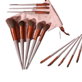 Set of 12 makeup brushes with rose gold and matte gray handles, soft synthetic bristles for refreshing matcha green makeup tool use