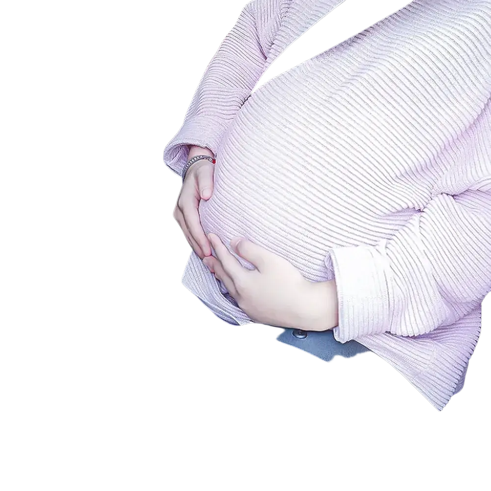 A soft pink ribbed knit maternity sweater worn by a pregnant person seated in a car using a car seat belt adjuster