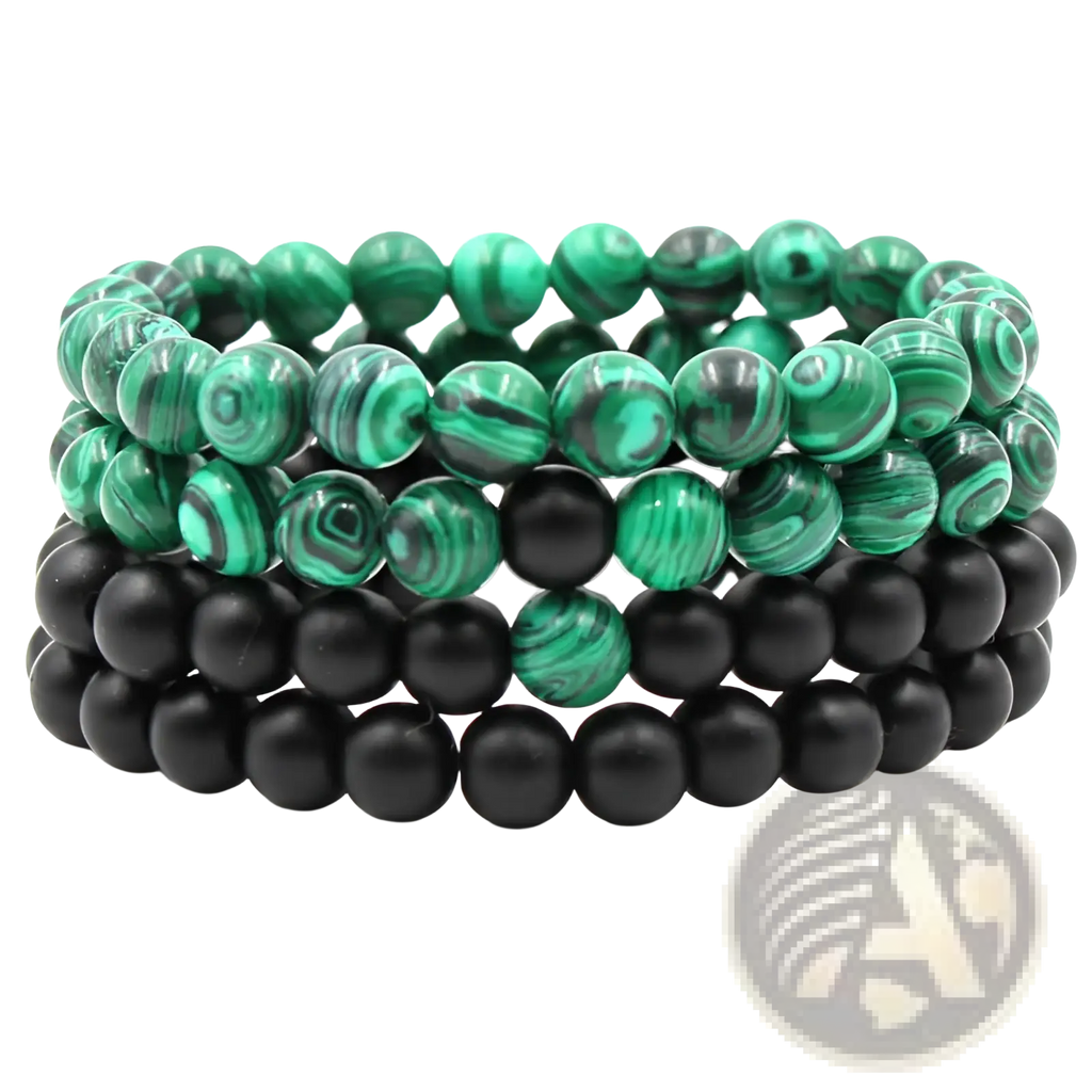 Stacked matte black and green malachite elastic bead bracelets with swirling green patterns and smooth finish