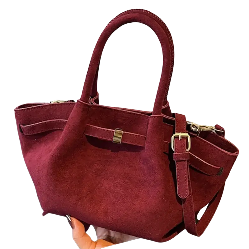 Matte leather crossbody bag in rich burgundy suede with gold hardware and adjustable shoulder strap for versatile wear