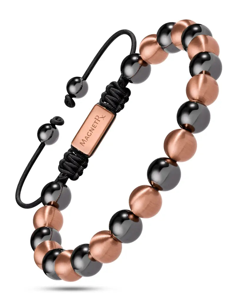 A sleek max strength magnetic hematite and copper beaded bracelet with black beads and rose gold magnetrx clasp