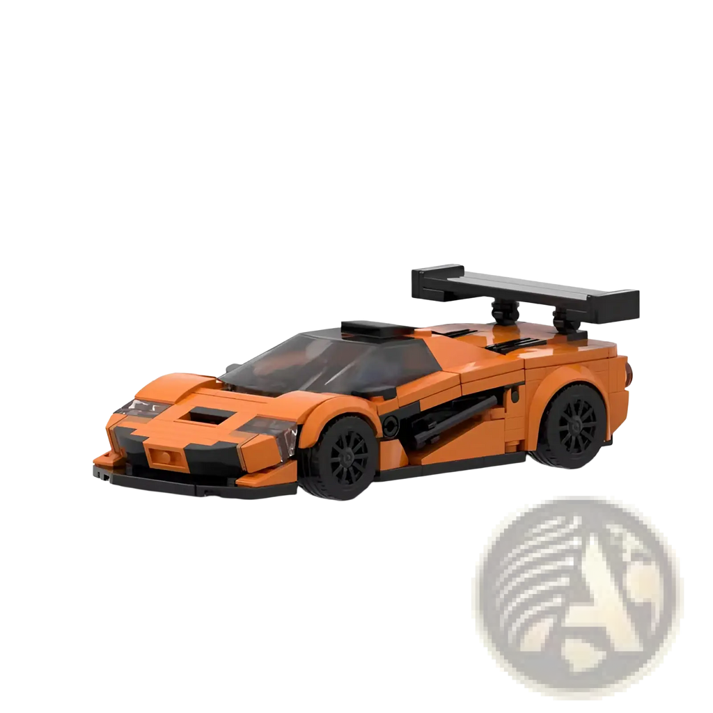 Orange and black lego McLaren F1 GTR race car model with prominent rear spoiler shown from the back side