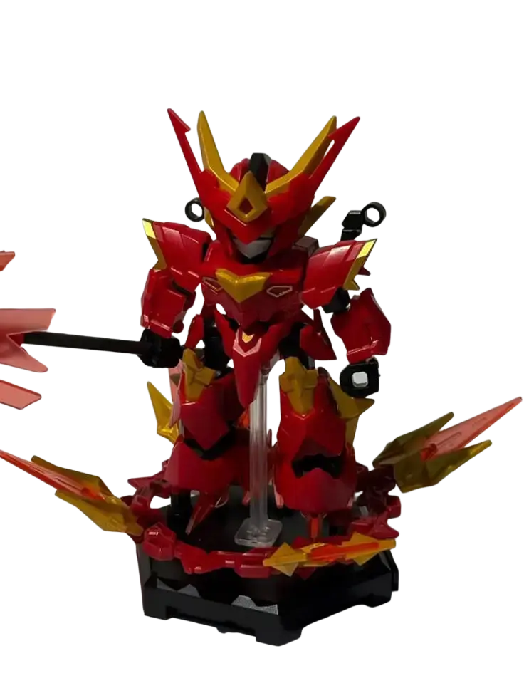 Red and gold plastic mecha building blocks robot toy with angular armor and sharp wing-like protrusions holding a black staff