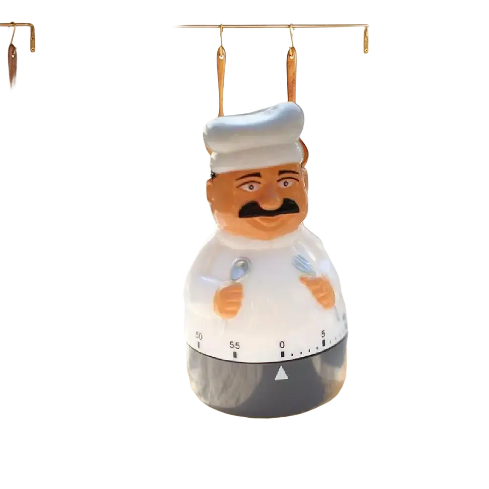 Mechanical chef kitchen timer with white chef hat, mustache, apron design, clear plastic body, and gray base