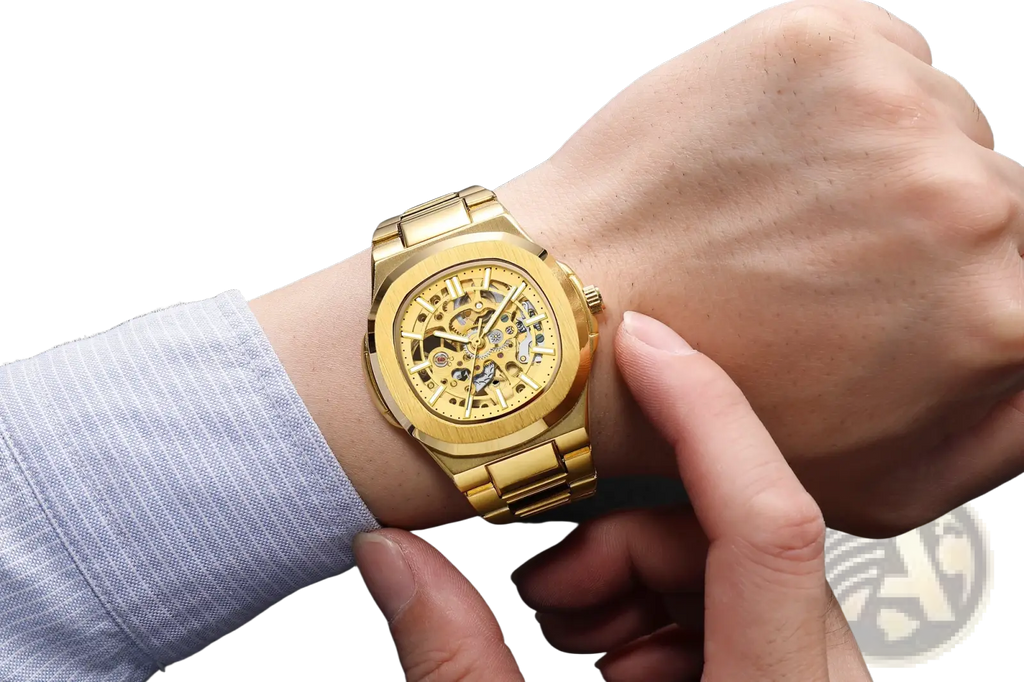 Mechanical skeleton watch in gold tone featuring exposed gears and a polished stainless steel bracelet