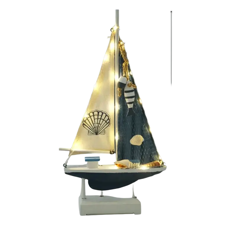 Mediterranean style wooden led sailing boat home decor with cream sail, black seashell design, string lights, and sea ornaments