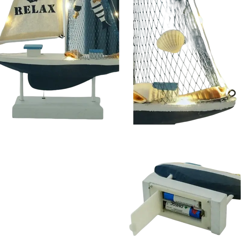 Mediterranean style wooden led sailing boat home decor in navy and cream with netted mast seashells and string lights