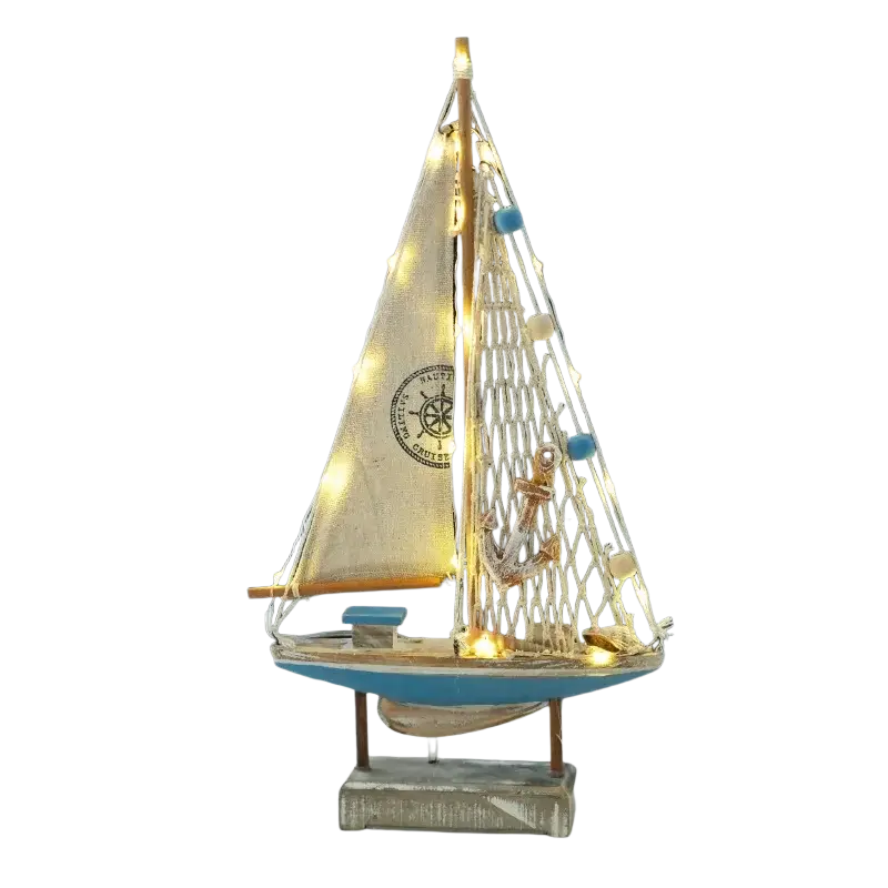 Mediterranean style wooden led sailing boat home decor with blue hull beige sails and warm string lights