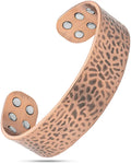 Copper-colored hammered metal magnetic therapy cuff bracelet with six circular magnets on each end for mega strength relief