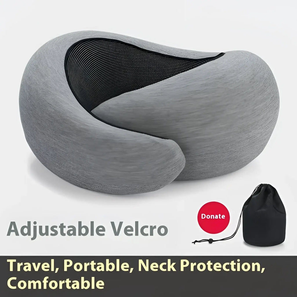 Gray memory foam travel neck pillow with adjustable velcro straps and black mesh interior for support and comfort