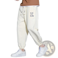 Men astronaut graphic joggers casual pants in cream cotton with drawstring waistband and embroidered bear patch on thigh