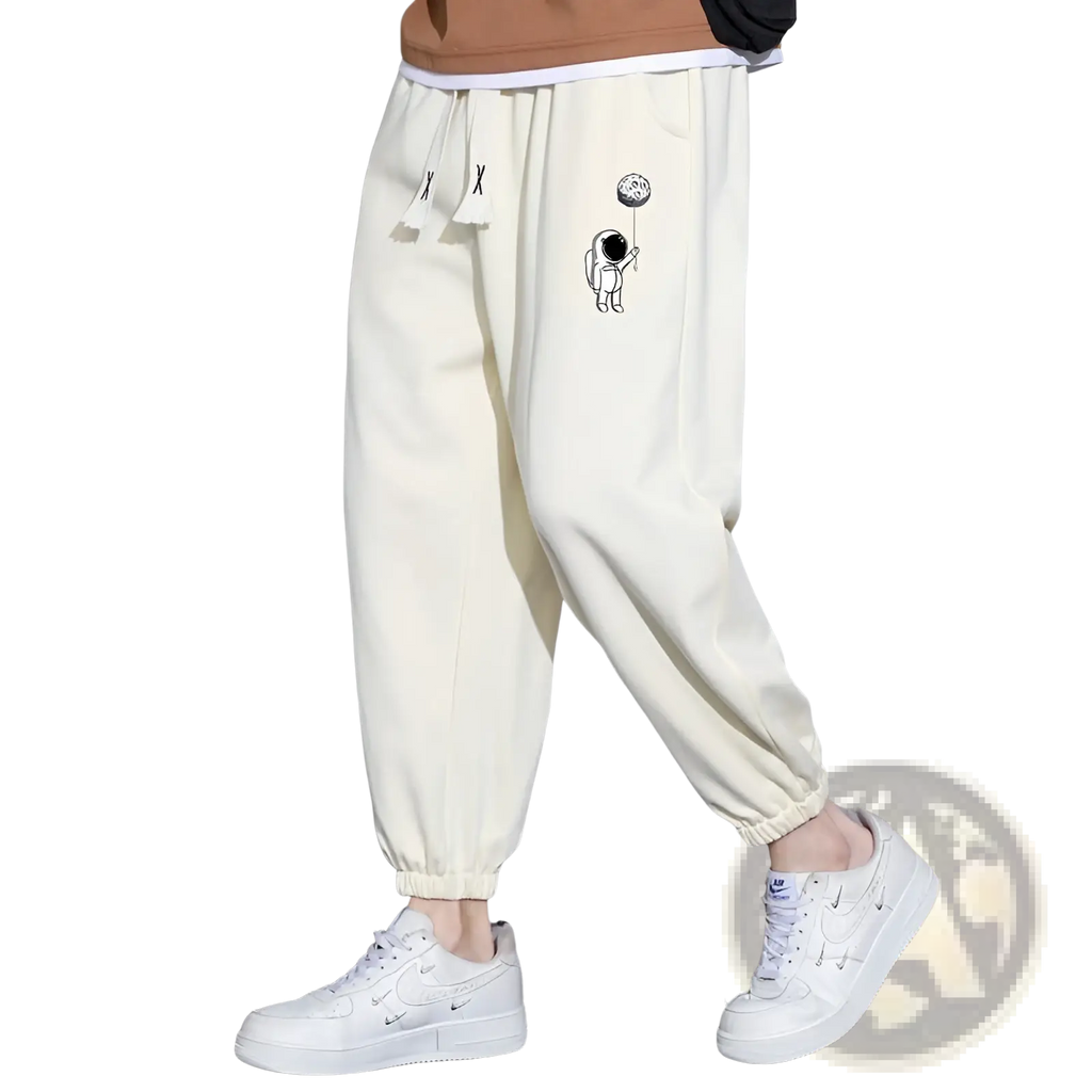 Cream-colored cotton men astronaut graphic joggers with drawstring waistband for casual wear