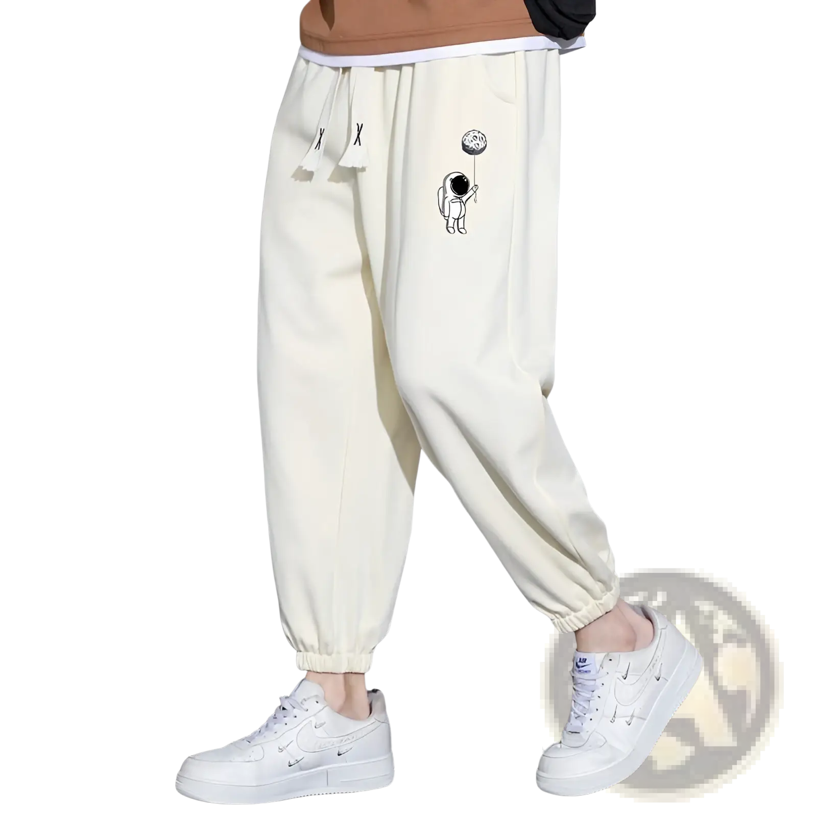 Cream-colored cotton men astronaut graphic joggers with drawstring waistband for casual wear