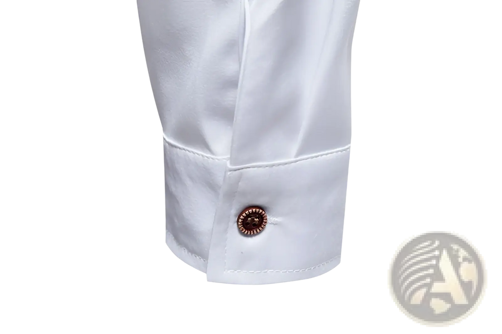 White cotton cuff with copper-toned ornate button on men asymmetrical slant collar long sleeve casual shirt