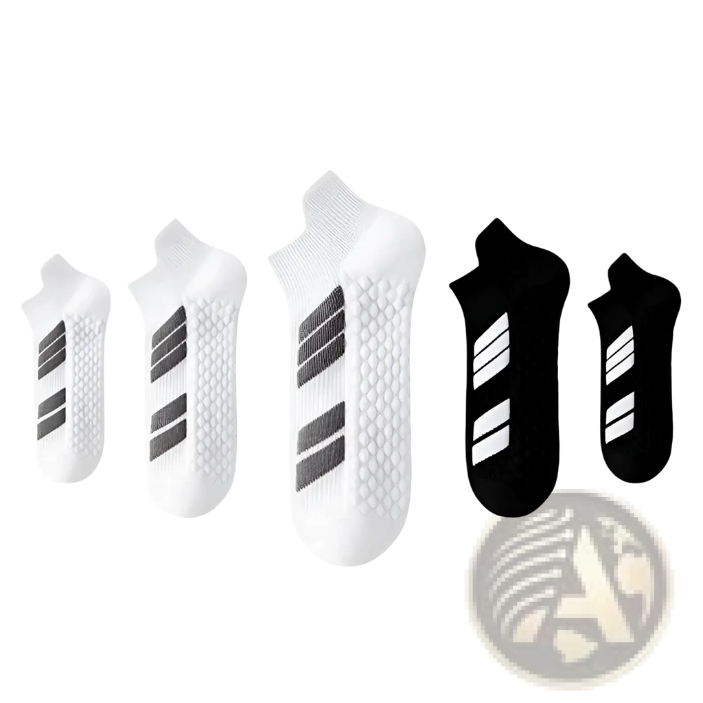 White and black men athletic sports socks with cushioned footbed, sweat absorbing material, and textured grip soles