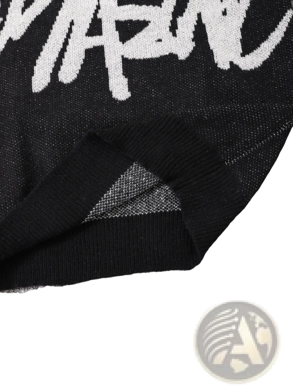 Men black knit sweater featuring a bold white Stussy logo across the chest in a graphic design style
