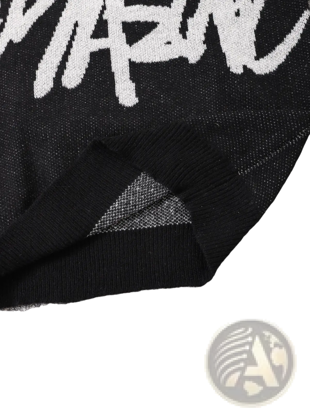 Men black knit sweater featuring a bold white Stussy logo across the chest in a graphic design style