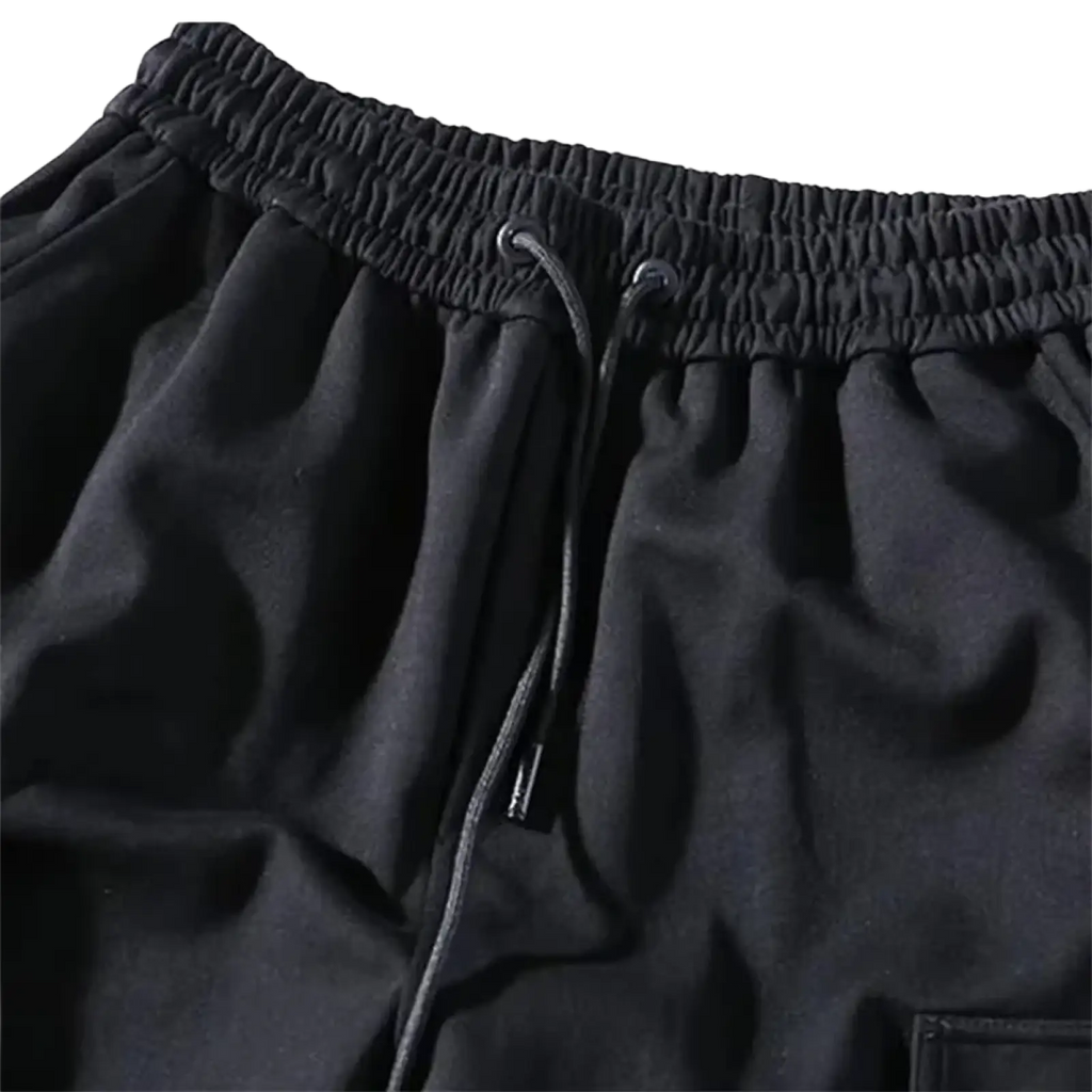 Men black cargo jogger pants with elastic waistband drawstring and soft textured fabric for comfortable wear