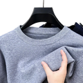 Men black crewneck knit sweater in soft heather gray with ribbed neckline and gentle textured fabric